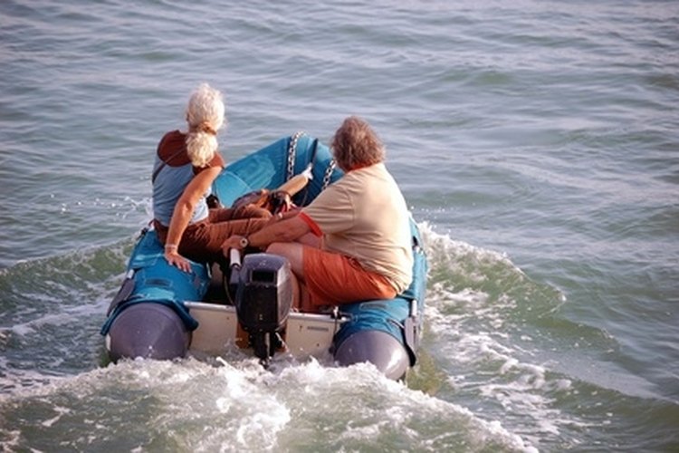 inflatible boat image by Wimbledon from Fotolia.com You can fix small tears in your inflatable boat yourself