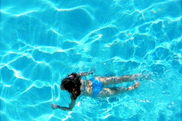 woman swimming image by nextrecord from Fotolia.com Keep your pool clean with the Intex Saltwater System.