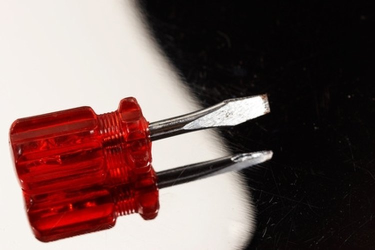 screwdriver image by AGphotographer from Fotolia.com The battery cap on a Bushnell scope is easily removed with a screwdriver.