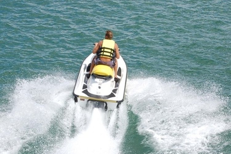 accelerating jet ski image by Wimbledon from Fotolia.com Jet skis are a fun way of exploring the sea and lakes.