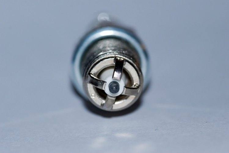 spark image by Zbigniew Nowak from Fotolia.com Inspect the spark plug tip to check an outboard motor for spark.