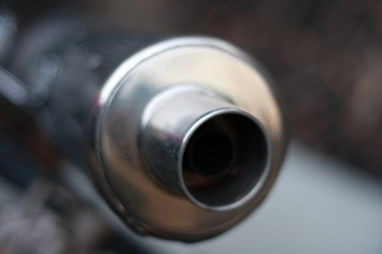 Motorcycle exhaust image by Crisps85 from Fotolia.com Honda motorcycle baffles are loctated just inside the tip of the tailpipe.