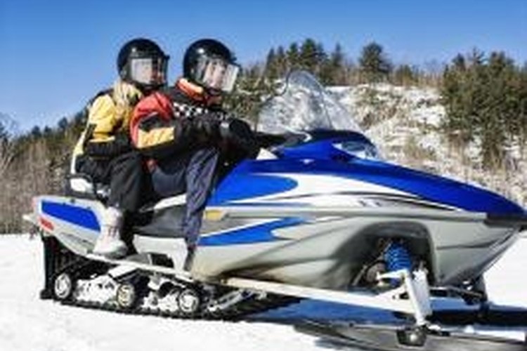 Jupiterimages/Brand X Pictures/Getty Images Snowmobile hand warmers supply heat via an electrical coil.