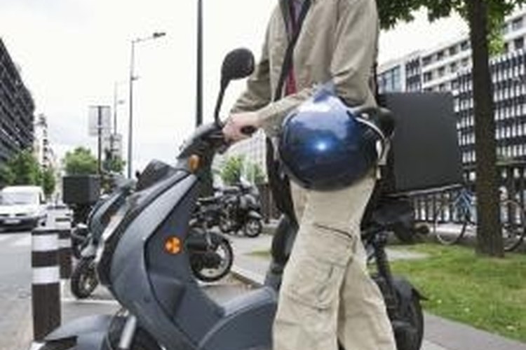 Jupiterimages/Goodshoot/Getty Images 50cc carburetors help to operate scooters.