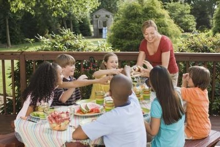 Jupiterimages/Comstock/Getty Images Protect your backyard event with a pop up canopy.