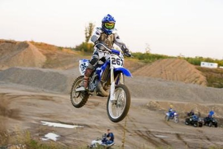 Jupiterimages/Creatas/Getty Images Tuning up your 1973 Yamaha 125cc motorcycle improves performance.