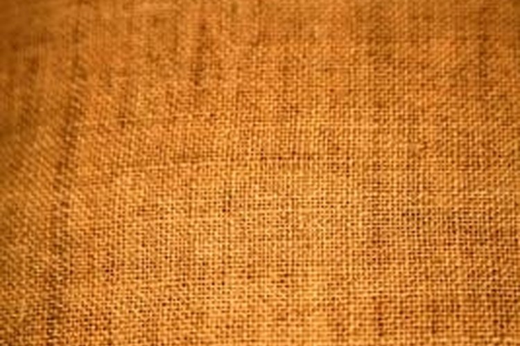 Jupiterimages/Photos.com/Getty Images Use burlap cloth as camouflage for a rifle.