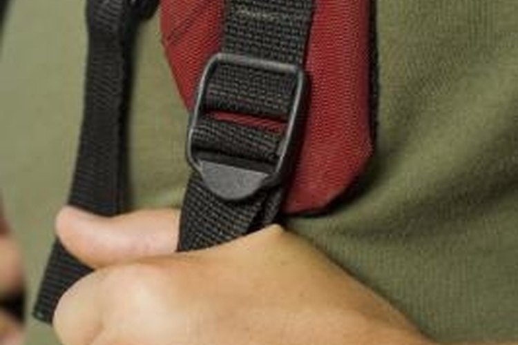 Jupiterimages/Pixland/Getty Images Double-backed straps are the safest way to secure your backpack.