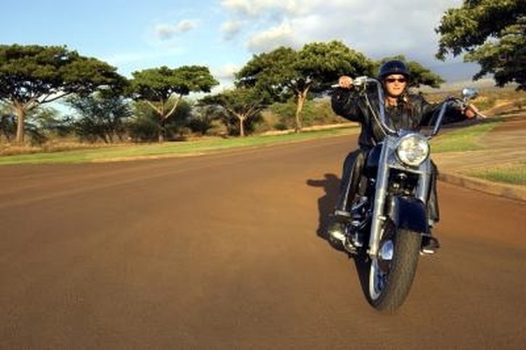 Thinkstock/Comstock/Getty Images Motorcycle and snowmobile helmets protect riders from serious or fatal head injuries.