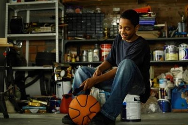 John Howard/Lifesize/Getty Images Check that your pump is working properly before you start inflating the ball.