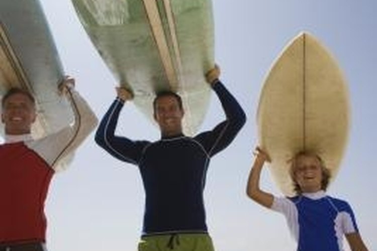 Jupiterimages, Brand X Pictures/Brand X Pictures/Getty Images Rash guards and board shorts are essential surf wear.
