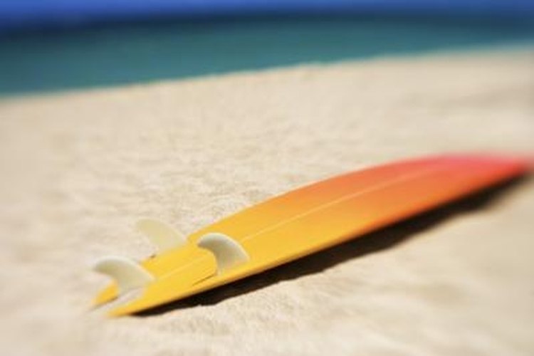 Thinkstock/Comstock/Getty Images Refinish your surfboard so it looks like new.