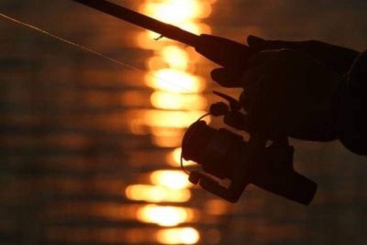 Jupiterimages/Photos.com/Getty Images Maintain the drag on your spinning reel.