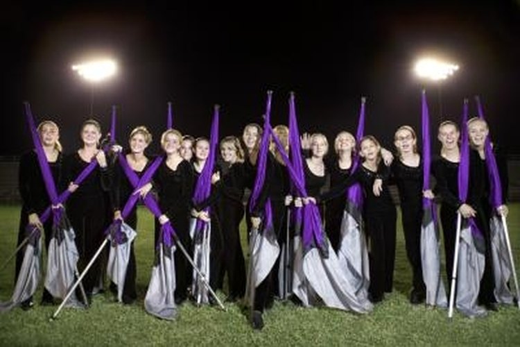 Thinkstock Images/Comstock/Getty Images Spinning in a color guard requires learning some new skills, but it can be a rewarding experience.