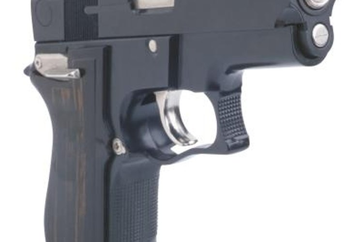 Ablestock.com/AbleStock.com/Getty Images 1911-style handguns come with adjustable triggers.