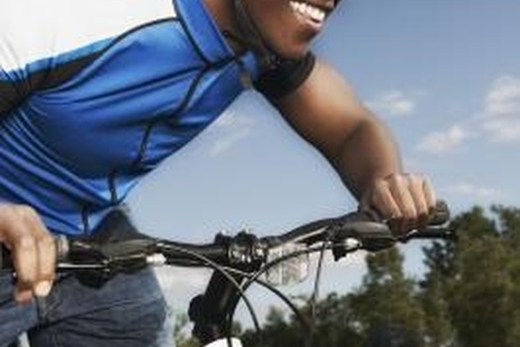 Jupiterimages/Brand X Pictures/Getty Images A PopLoc on the front fork of a mountain bike allows the rider to adjust the vertical travel of the fork on the fly.