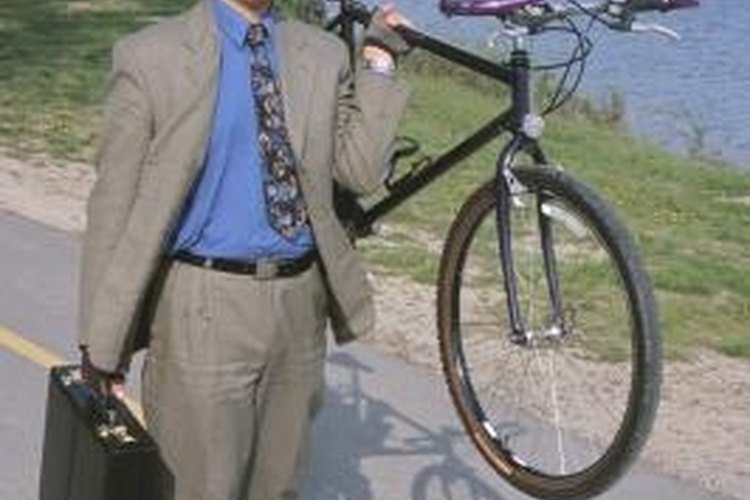 Hemera Technologies/Photos.com/Getty Images Don't be like this guy. Use a bike rack to transport your beloved two-wheelers.
