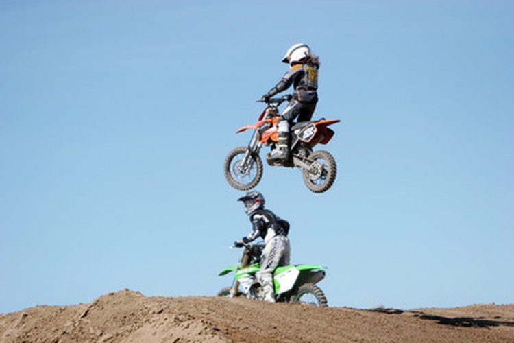 dirt bike airborne image by MAXFX from Fotolia.com Straighten minor damages to motorcycle frames in a workshop.
