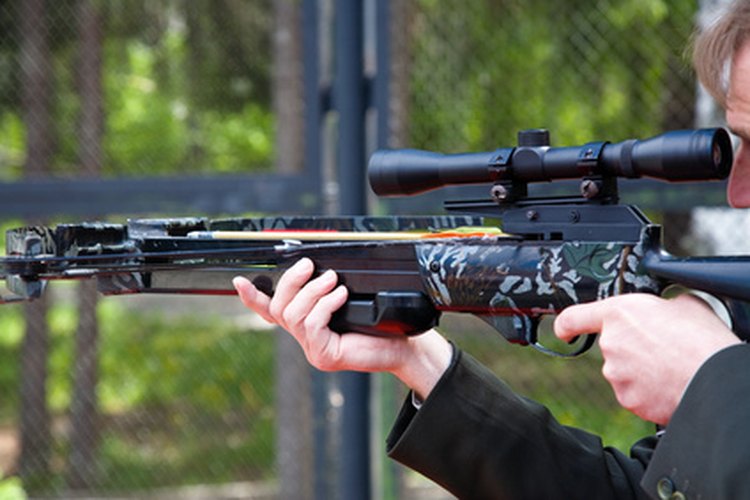 Men crossbow shooting image by Igor Zhorov from Fotolia.com Start off using a crossbow scope by getting it sighted-in.