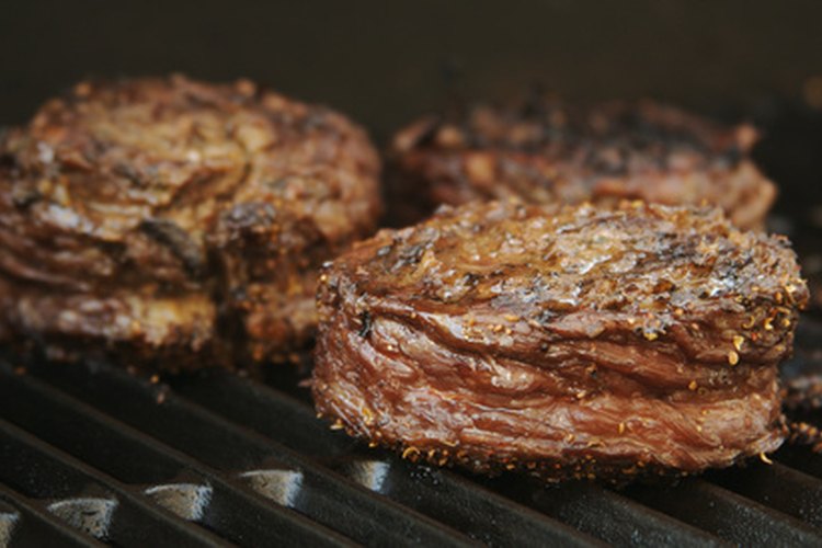 Succulent Wrapped Flank Steak BBQ image by Andy Dean from Fotolia.com Like beef, venison can be sliced into steaks for the grill.