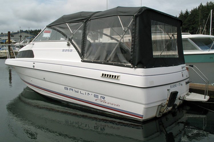 boat image by pearlguy from Fotolia.com You can learn to read an hour gauge on your boat engine.