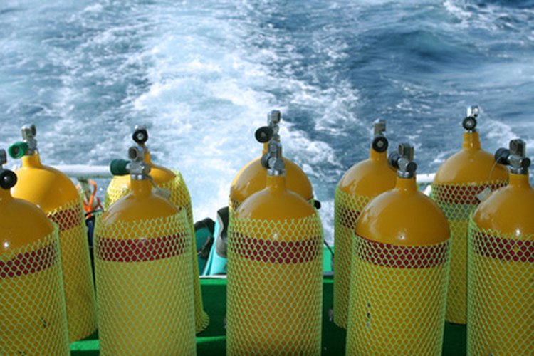 diving tank image by Marcin Wasilewski from Fotolia.com Scuba tanks are pressurized cylinders that require regular hydrostatic testing.