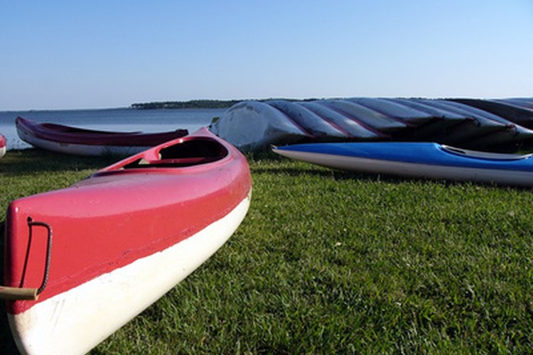 canoe image by Pascal Perinelle from Fotolia.com Refurbishing old fiberglass canoes restores their luster.