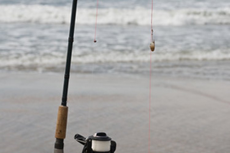 Fishing in Gambian into the Atlantic Ocean image by PJGCC from Fotolia.com Fishing from a beach can mean sand and saltwater in your reel.