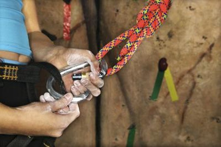 Thinkstock Images/Comstock/Getty Images Use a carabiner to secure your harness.