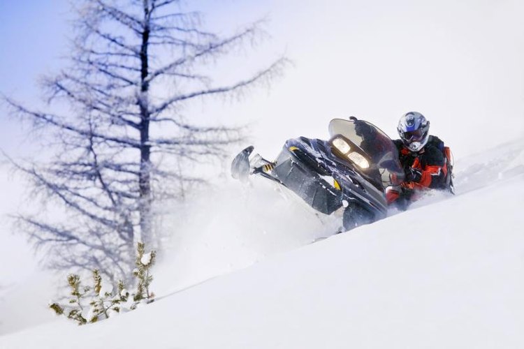 Design Pics/Design Pics/Getty Images Keeping your track tension correctly adjusted is a part of monthly maintenance.
