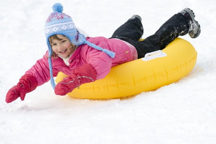 Wojciech Gajda/iStock/Getty Images Winter clothing is essential for snow tubers.