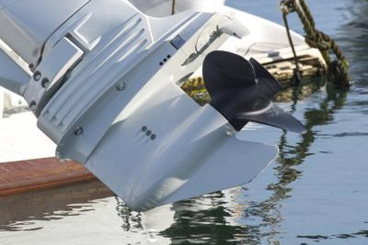 viti/iStock/Getty Images Large outboard boat motor above the water.