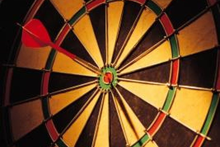 Comstock/Comstock/Getty Images Having a practice dartboard at home can bring your dart playing to the next level.