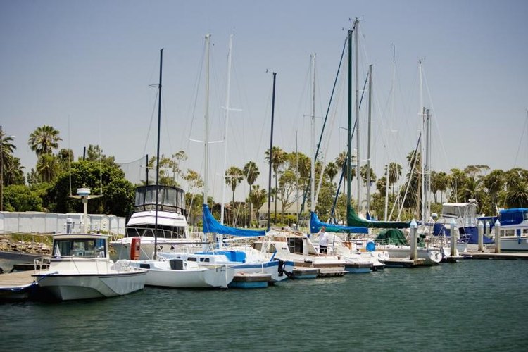 Medioimages/Photodisc/Photodisc/Getty Images Boats docked at a marina.