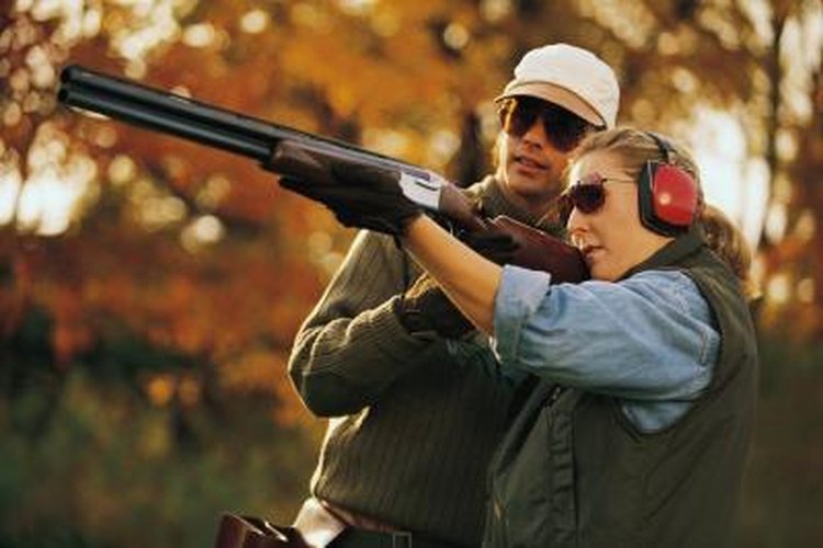Comstock/Stockbyte/Getty Images Couple shooting skeet
