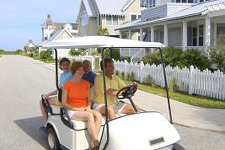 Jupiterimages/Comstock/Getty Images Replace headlights on your golf cart to increase safety.