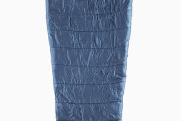Ryan McVay/Photodisc/Getty Images Tightly rolling a mummy bag makes it easier to carry when hiking.