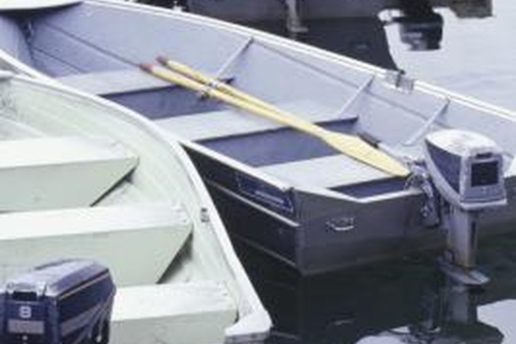 Steve Mason/Photodisc/Getty Images A boat engine should be checked for damage regularly.