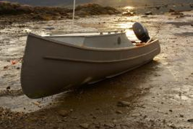 Jupiterimages/Photos.com/Getty Images Larger outboard motors require external fuel tanks.