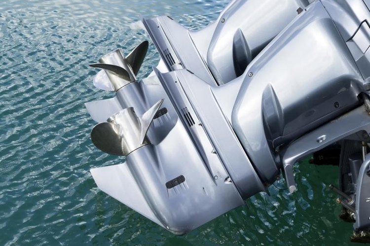 leonardo viti/iStock/Getty Images Outboard motors on a boat.