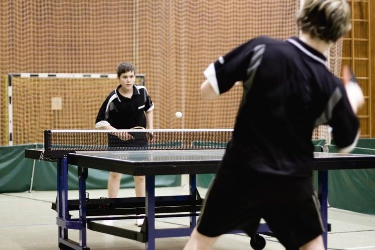 Edite Artmann/Hemera/Getty Images Two competitors playing a game of table tennis.