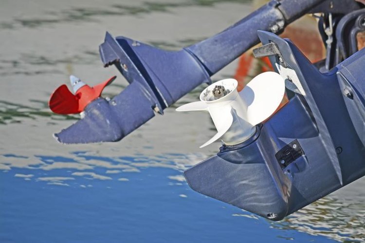 Gabriele Maltinti/iStock/Getty Images A closeup of an outboard motor.