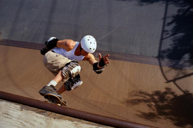 Ryan McVay/Stockbyte/Getty Images Many skateboard tricks feature spinning or flipping.