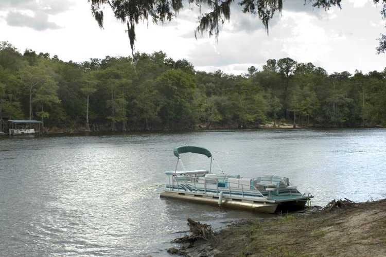 Stacey Lynn Brown/iStock/Getty Images Carry on down the river with your spiffed-up pontoon boat.