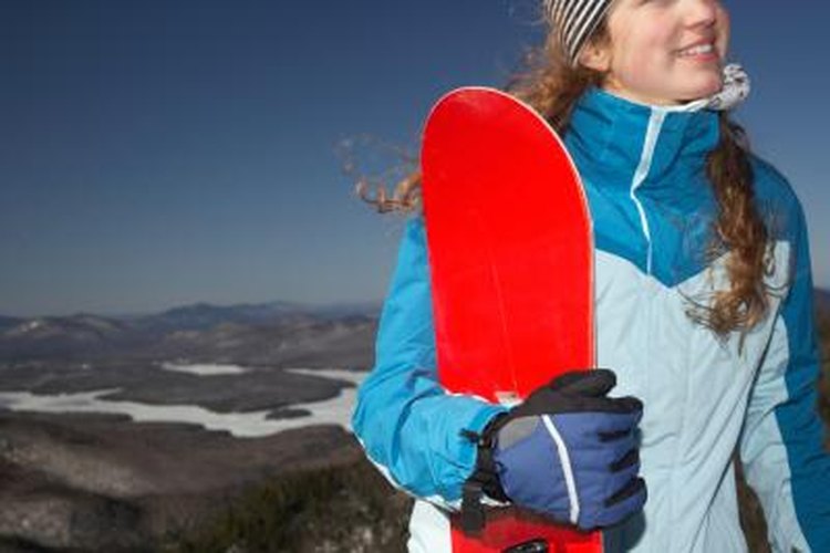Michael Turek/Photodisc/Getty Images Size a snowboard by standing it up next to you.