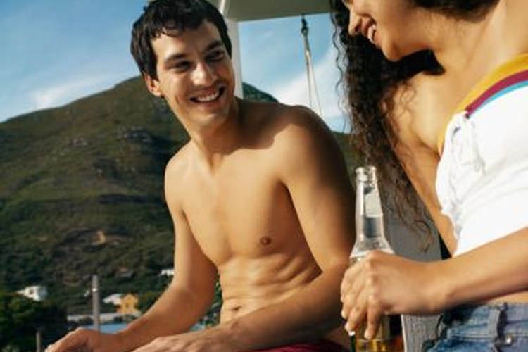 Stockbyte/Stockbyte/Getty Images Waxing helps prevent you from slipping on a soft-top surfboard.