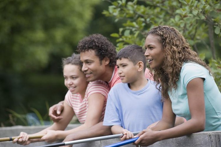 ERproductions Ltd/Blend Images/Getty Images Friends fishing together off of wooden bridge.