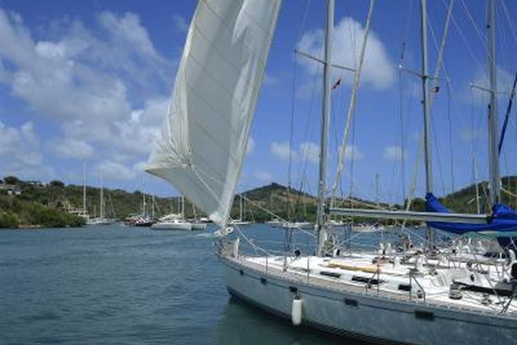 Jupiterimages/liquidlibrary/Getty Images A sailboat sits in port.