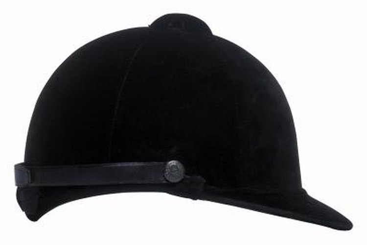 Comstock/Comstock/Getty Images Riding helmets protect the head during equestrian events.