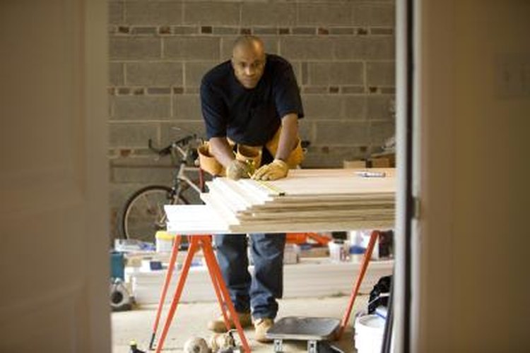 David Sacks/Lifesize/Getty Images Hoisting that canoe out of the way restores your lost garage space.